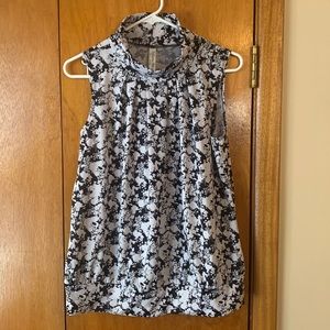 PerSeption Petite sleeveless top with high neck and banded bottom.